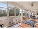 Relaxing screened porch with wicker furniture and view of the backyard at 3618 Highway 430, Nichols, SC 29581