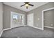 Bedroom with grey carpet, ceiling fan and access to balcony at 369 Saint Julian Ln., Myrtle Beach, SC 29579