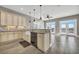 Modern kitchen with island, farmhouse sink, and access to balcony at 369 Saint Julian Ln., Myrtle Beach, SC 29579