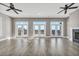 Sunlit living room with hardwood floors and access to balcony at 369 Saint Julian Ln., Myrtle Beach, SC 29579