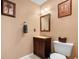 Small bathroom with single sink vanity, toilet, and shower at 3700 Golf Colony Lane # 24B, Little River, SC 29566