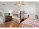 Charming bedroom with hardwood floors and bunk beds at 3700 Golf Colony Lane # 24B, Little River, SC 29566