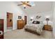 Spacious bedroom with carpeted floor and ensuite bathroom at 3700 Golf Colony Lane # 24B, Little River, SC 29566