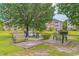 Community grilling area with picnic tables and seating near a pond at 3951 Gladiola Ct. # 204, Myrtle Beach, SC 29588