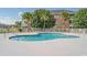 Community swimming pool with surrounding patio at 3951 Gladiola Ct. # 204, Myrtle Beach, SC 29588