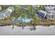 Stunning beachfront amenity center with blue roof, manicured grounds, and convenient parking at 41 Federation Loop, Pawleys Island, SC 29585