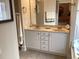 Bathroom vanity with double sinks, white cabinets, and a large mirror at 41 Federation Loop, Pawleys Island, SC 29585
