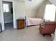 Bedroom in converted attic space with bed, closet, window, and access to the bathroom at 41 Federation Loop, Pawleys Island, SC 29585