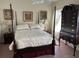 Well-lit bedroom with a four-poster bed and antique furniture at 41 Federation Loop, Pawleys Island, SC 29585