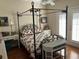 Bright bedroom featuring a black iron bed frame and white doors at 41 Federation Loop, Pawleys Island, SC 29585