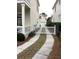 Curved driveway with white gate leading to garage at 41 Federation Loop, Pawleys Island, SC 29585