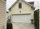 Exterior view of garage, side staircase, and tasteful landscaping at 41 Federation Loop, Pawleys Island, SC 29585