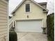 Attached garage with white door and exterior stairs at 41 Federation Loop, Pawleys Island, SC 29585