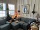 Cozy living room with board and batten walls, large windows, and comfortable seating at 41 Federation Loop, Pawleys Island, SC 29585