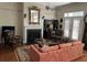 Living room with fireplace, French doors, and plush sofa at 41 Federation Loop, Pawleys Island, SC 29585