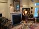 Living room with fireplace, ornate mirror, and comfortable seating at 41 Federation Loop, Pawleys Island, SC 29585