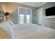 Spacious bedroom with king-size bed and private balcony access at 4208 N Ocean Blvd., North Myrtle Beach, SC 29582