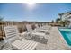 White lounge chairs around a resort-style pool at 4208 N Ocean Blvd., North Myrtle Beach, SC 29582