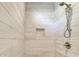 Shower stall with light wood-look tile at 4208 N Ocean Blvd., North Myrtle Beach, SC 29582