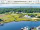 Aerial view of waterfront property with golf course at 4413 East Port Blvd. # F-6, Little River, SC 29566