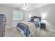 Cozy bedroom with a queen-size bed and ceiling fan at 4413 East Port Blvd. # F-6, Little River, SC 29566