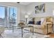 Living room with beige sofa and glass coffee table at 4413 East Port Blvd. # F-6, Little River, SC 29566