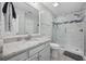 Bathroom with granite countertop, shower, and toilet at 4524 N Plantation Dr. # D9, Little River, SC 29566