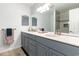 Modern bathroom with double vanity and tiled shower at 4705 Harness Ln., Murrells Inlet, SC 29576