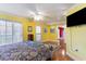 Bright bedroom with wood floors, large windows, and a ceiling fan at 4705 Harness Ln., Murrells Inlet, SC 29576