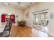 Bright dining area with hardwood floors and access to a screened porch at 4705 Harness Ln., Murrells Inlet, SC 29576