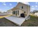 A spacious concrete patio extends from a sunroom, perfect for outdoor entertaining in this beautiful home at 4821 Southgate Pkwy., Myrtle Beach, SC 29579