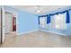 Light blue bedroom with wood floors and access to bath at 4821 Southgate Pkwy., Myrtle Beach, SC 29579