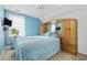 Bedroom with wood dresser and blue walls at 4821 Southgate Pkwy., Myrtle Beach, SC 29579