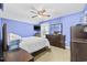 A bright bedroom featuring an expansive mirror, a ceiling fan, and neutral carpet flooring at 4821 Southgate Pkwy., Myrtle Beach, SC 29579