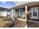 Cozy front porch with wicker furniture and brick accents near the entrance at 4821 Southgate Pkwy., Myrtle Beach, SC 29579