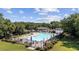 A community pool featuring lounge chairs and umbrellas, perfect for relaxing on hot summer days at 4821 Southgate Pkwy., Myrtle Beach, SC 29579