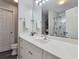 Bathroom with white vanity, shower, and linen storage at 49 Daniel Morrall Ln., Georgetown, SC 29440