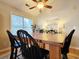 Dining room features a wooden table, four chairs, and a ceiling fan at 49 Daniel Morrall Ln., Georgetown, SC 29440