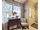 Welcoming entryway with chair and antique console table at 49 Daniel Morrall Ln., Georgetown, SC 29440