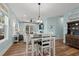 Bright dining area with white table and chairs near kitchen at 4918 Old Appleton Way, North Myrtle Beach, SC 29582