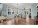 Bright dining area with white table and chairs near kitchen at 4918 Old Appleton Way, North Myrtle Beach, SC 29582