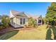 Charming yellow house with a covered porch and landscaping at 4918 Old Appleton Way, North Myrtle Beach, SC 29582