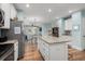 Island kitchen with stainless steel appliances and granite countertops at 4918 Old Appleton Way, North Myrtle Beach, SC 29582