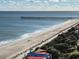 Aerial view of beach, pier, and coastline at 504 N Ocean Blvd. # 1003, Myrtle Beach, SC 29577