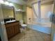 Clean bathroom with tub, shower, and vanity at 504 N Ocean Blvd. # 1003, Myrtle Beach, SC 29577