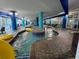 Indoor lazy river pool featuring multiple tubes and easy access ramps for relaxation and enjoyment at 504 N Ocean Blvd. # 1003, Myrtle Beach, SC 29577