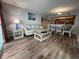 Inviting living space with a white sofa, lift-top coffee table, adjacent to the kitchen and dining area at 504 N Ocean Blvd. # 1003, Myrtle Beach, SC 29577