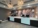 Modern lobby with stylish chandeliers and marble-like accent wall, creating an inviting atmosphere for guests at 504 N Ocean Blvd. # 1003, Myrtle Beach, SC 29577