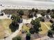 Aerial view of park with palm trees, walkways, and lounge chairs near the beach at 504 N Ocean Blvd. # 1003, Myrtle Beach, SC 29577