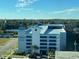 Exterior view of a multi-level parking garage with Homewood Suites signage at 504 N Ocean Blvd. # 1003, Myrtle Beach, SC 29577